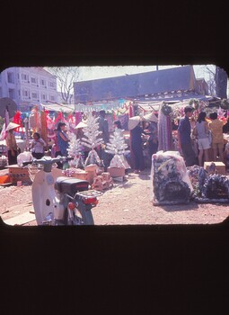A coloured slide of a street scene at a market