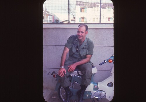 Solider sitting on a small scooter