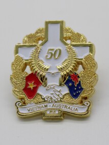 Commemorative Pin - A White cross with 50 in gold in centre.