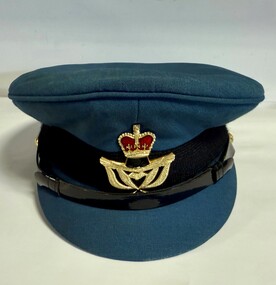 Blue RAAF peaked cap with black band and Warrant Officer's badge