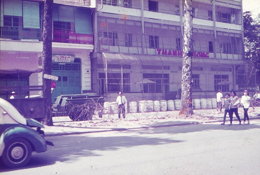 Buildings and road with barbed wire.