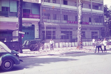 Buildings and road with barbed wire.