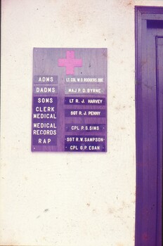 Board with medical red cross and medical personnel listed at HQ AFV.
