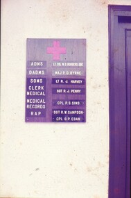 Board with medical red cross and medical personnel listed at HQ AFV.