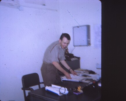 Dr Major Peter Dudley Byrne, at his desk