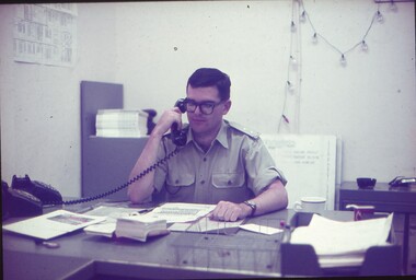 Lt Steve Phillips on the phone at his desk.