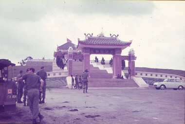 A group of Army personnel visiting a Monument for the fallen.