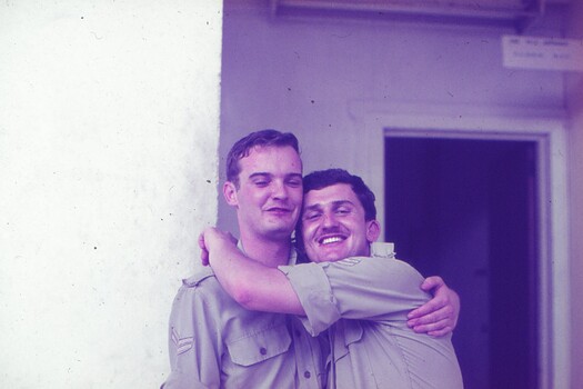 Cpl Gunther Reissig giving a hug to another soldier "mate".