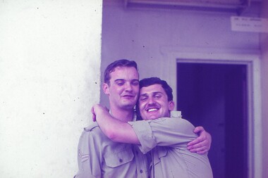 Cpl Gunther Reissig giving a hug to another soldier "mate".