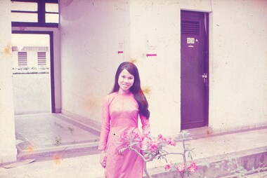 Female Thai interpreter in pink dress.