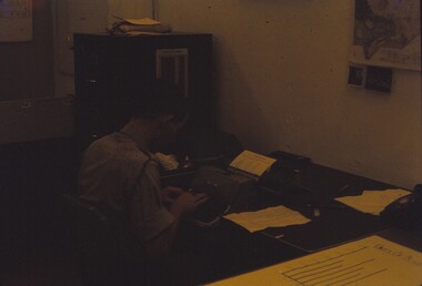Corporal Sims at his desk.