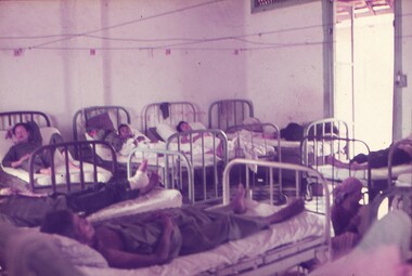 Patients in hospital beds.