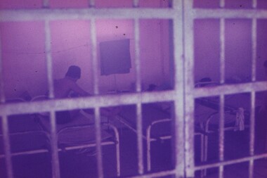 Hospital beds behind bars for prisoners.