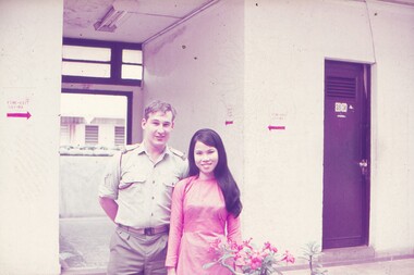 Cpl Sims with female interpreter posing for photo