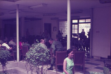 Band playing with soldiers watching.