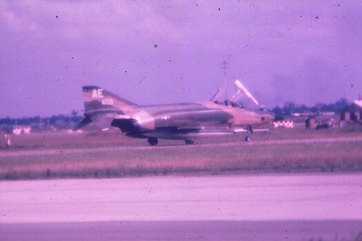 Fighter Jet sitting on runway.