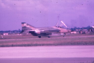 Fighter Jet sitting on runway.