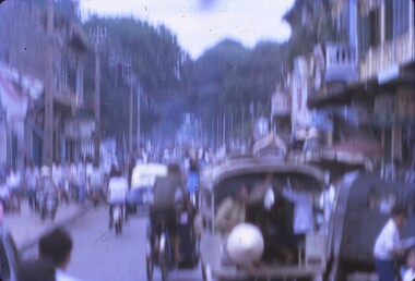 Blurred photo down centre of street in Cholon Vietnam