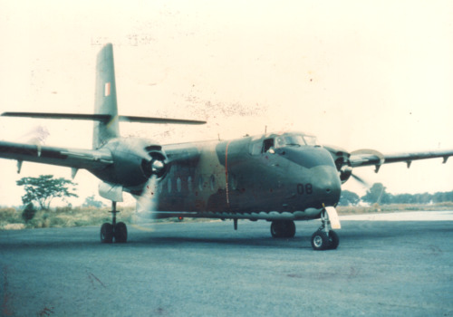 A coloured photograph of a Caribou plane on the ground.