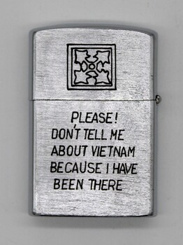 Small silver zippo lighter with text "Please Don't tell Me About Vietnam Because I Have Been There"