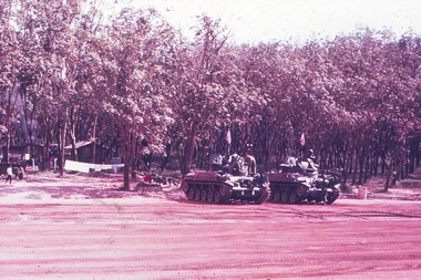 2 Tanks parked near runway.