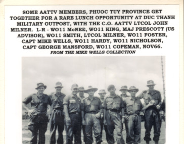 A copy of a black and white photograph of some AATTV members at Phuoc Tuy Province in Nov 66