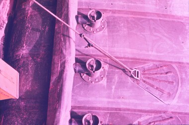 Rope attached to building for support.