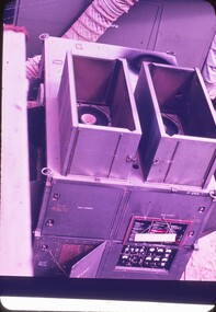 Rectangle metal box with multiple doors, gauges, and vents.