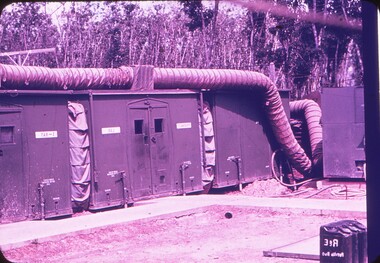 Rectangle buildings with flexible piping transporting air.