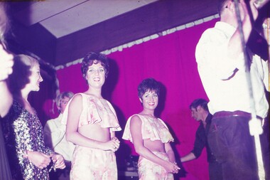 Two female entertainers looking at camera waiting to perform.