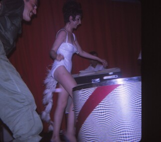 Female entertainer walking through backstage.