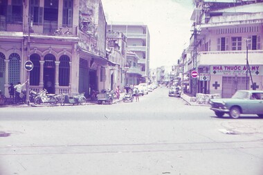 Looking down a street from cross roads with buildings lining the street.