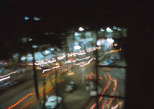 Blurred photo of street at night.