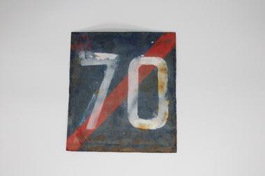Metal blue square sign with red diagonal stripe, running top right to bottom left, and white number 70.