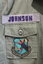 Close up of Name badge and unit badge on right side breast pocket.