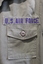 Close up of U.S Air Force badge about left breast pocket.