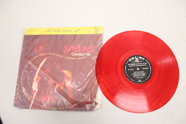 A LP stereo record cover and a red vinyl record. 