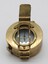 A brass compass with opening lid which is considered to be standard army issue.