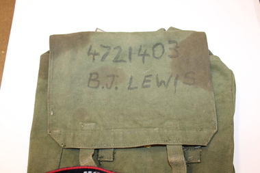 Heavy duty canvas back pack with details of soldiers service number and name and initials.