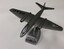 A solid metal model of a USAF B57 on a metal stand.