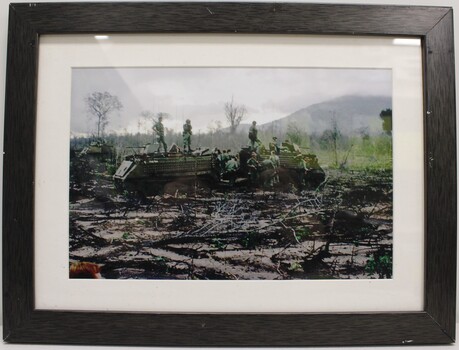 Two Tracked M113 Vehicles with Soldiers on Top and on the Ground