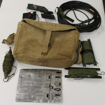 Army canvas satchel with contents used to store antenna equipment.