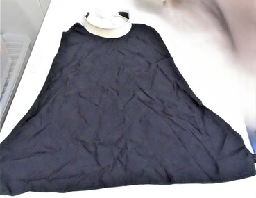 A priest detachable collar and black front vest.