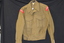 An wool army issue battle jacket with red patches on either sleeve,