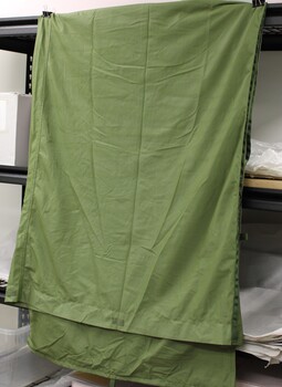 Khaki coloured nylon bag used to line a sleeping bag.