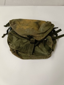 Green army issue duffel bag with four (4) compartments.
