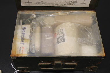 A metal box with fifteen items with a list of items included.