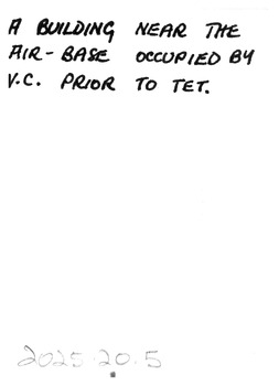 Back of photograph text reads: A building near the air-base occupied by V.C. prior to TET.