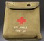 Small canvas pouch with the red cross symbol in the centre; Kit Jungle First Aid printed on the front. 