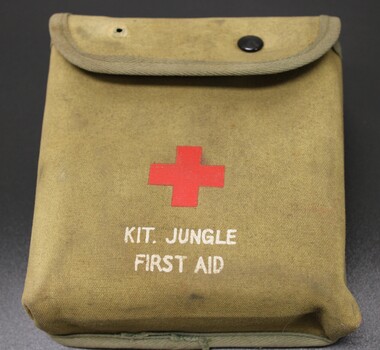 Small canvas pouch with the red cross symbol in the centre; Kit Jungle First Aid printed on the front. 